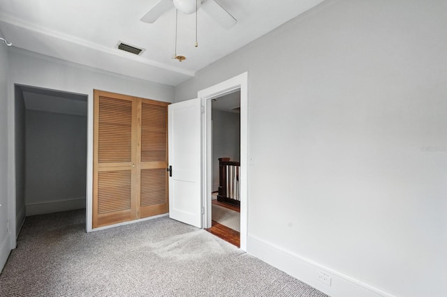 200 N St, Daytona Beach, FL 32114 - unfurnished bedroom featuring a closet, carpet, and a ceiling fan