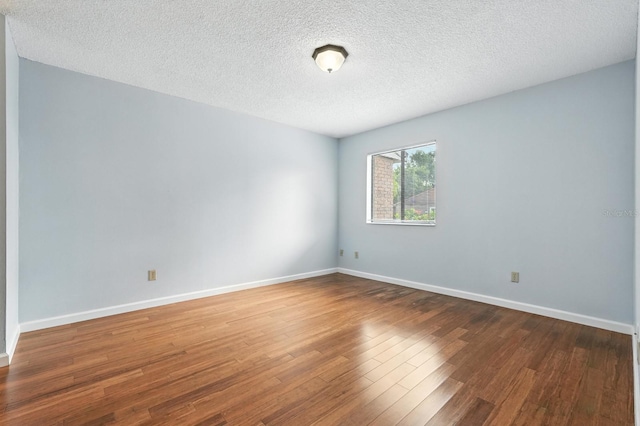 1512 Heritage Ln, Daytona Beach, FL 32117 - spare room featuring wood finished floors and a textured ceiling