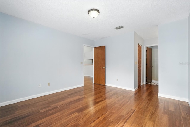 1512 Heritage Ln, Daytona Beach, FL 32117 - empty room with wood finished floors and a textured ceiling