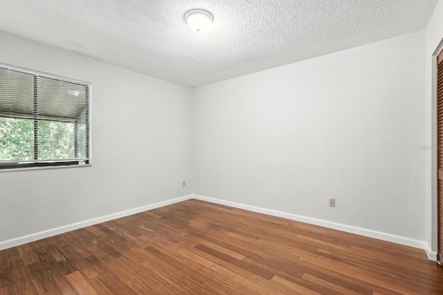 1512 Heritage Ln, Daytona Beach, FL 32117 - empty room featuring wood finished floors and a textured ceiling