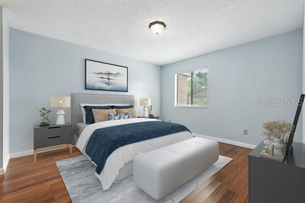 1512 Heritage Ln, Daytona Beach, FL 32117 - bedroom with a textured ceiling and wood finished floors