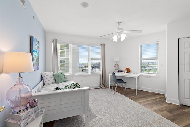 3315 S Atlantic Ave Unit 408, Daytona Beach Shores, FL 32118 - bedroom with wood finished floors and ceiling fan