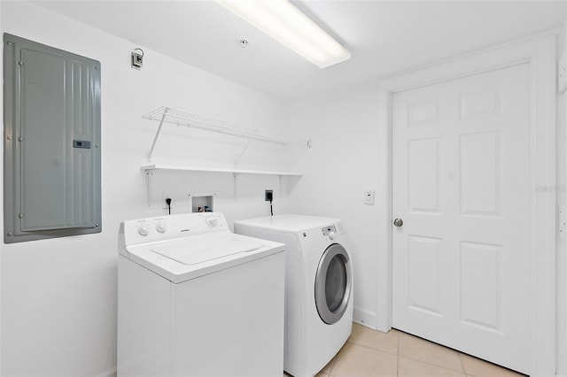 3315 S Atlantic Ave Unit 408, Daytona Beach Shores, FL 32118 - washroom with separate washer and dryer, electric panel, and light tile patterned floors