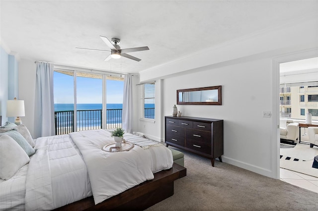 3315 S Atlantic Ave Unit 408, Daytona Beach Shores, FL 32118 - bedroom with access to exterior, a water view, carpet floors, and ceiling fan