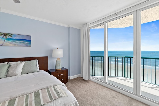 3315 S Atlantic Ave Unit 408, Daytona Beach Shores, FL 32118 - bedroom featuring access to exterior, carpet flooring, view of water and beach, and crown molding