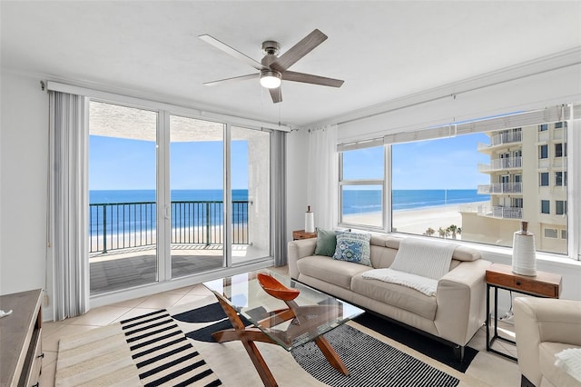 3315 S Atlantic Ave Unit 408, Daytona Beach Shores, FL 32118 - living room featuring a water view, ceiling fan, and light tile patterned flooring