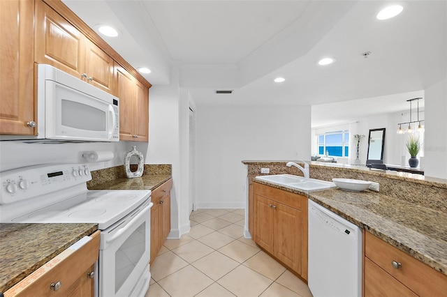 3315 S Atlantic Ave Unit 408, Daytona Beach Shores, FL 32118 - kitchen featuring white appliances, recessed lighting, stone counters, light tile patterned floors, and brown cabinets