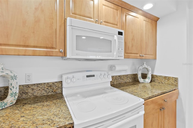 3315 S Atlantic Ave Unit 408, Daytona Beach Shores, FL 32118 - kitchen with white appliances and light stone countertops