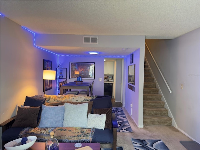4155 S Semoran Blvd Unit 8, Orlando, FL 32822 - carpeted living room featuring stairs and a textured ceiling
