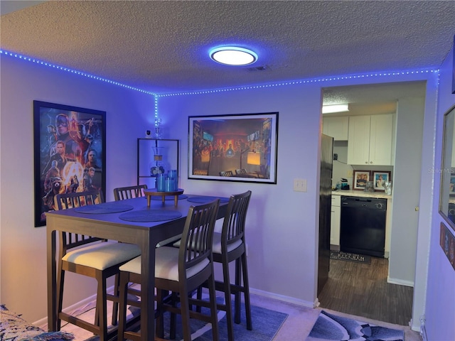 4155 S Semoran Blvd Unit 8, Orlando, FL 32822 - dining room with a textured ceiling and wood finished floors