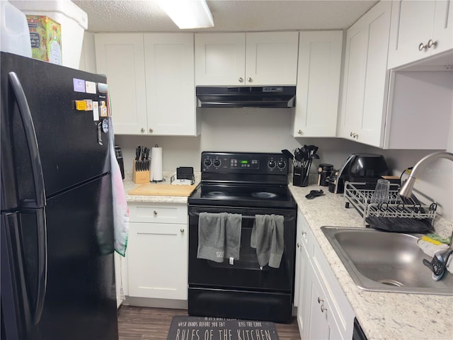 4155 S Semoran Blvd Unit 8, Orlando, FL 32822 - kitchen featuring black appliances, white cabinets, dark wood-style floors, and under cabinet range hood