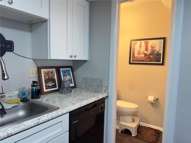 4155 S Semoran Blvd Unit 8, Orlando, FL 32822 - kitchen with dishwasher, white cabinets, and wood finished floors