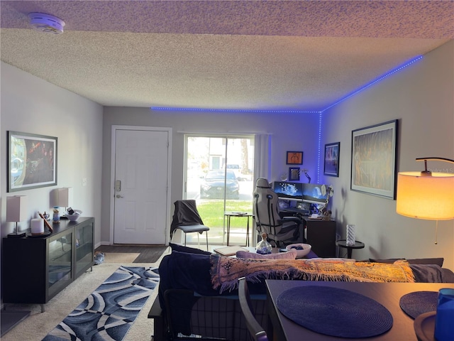 4155 S Semoran Blvd Unit 8, Orlando, FL 32822 - living room featuring a textured ceiling and an office area