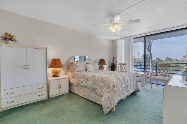 carpeted bedroom with a closet, a textured ceiling, and ceiling fan