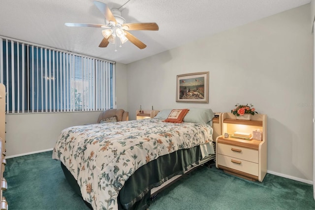 carpeted bedroom with a textured ceiling and ceiling fan