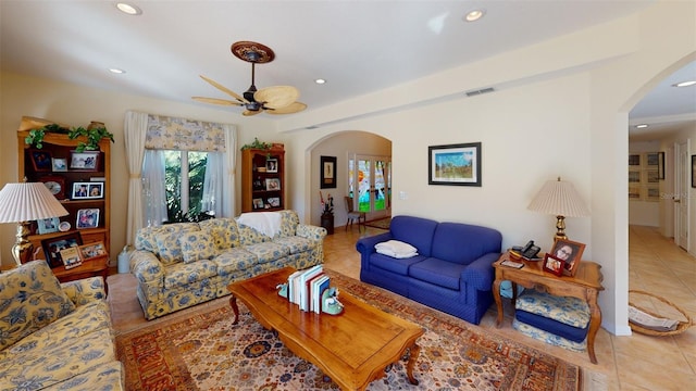 tiled living room with ceiling fan