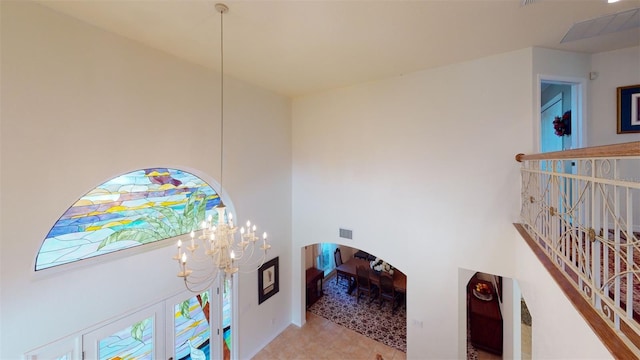 hallway with a notable chandelier