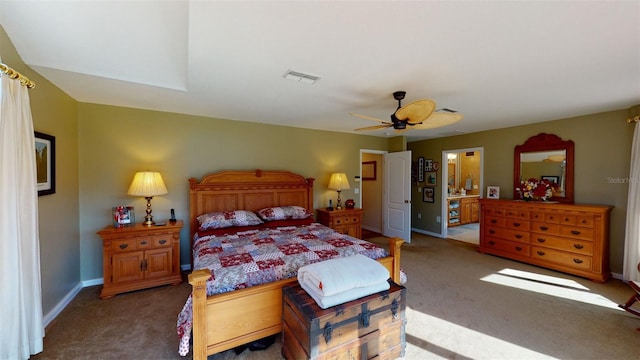 bedroom with carpet, ceiling fan, and ensuite bath