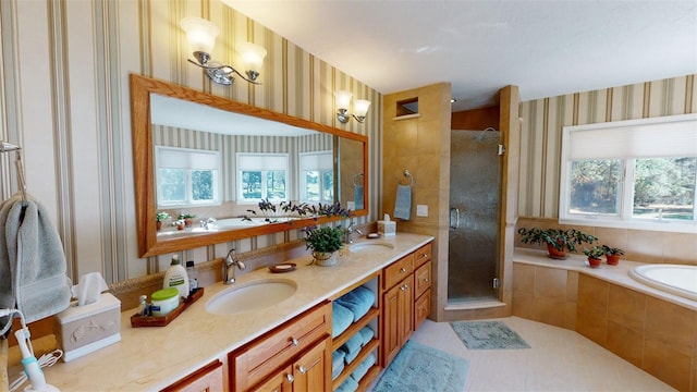 bathroom featuring tile patterned flooring, vanity, plenty of natural light, and plus walk in shower