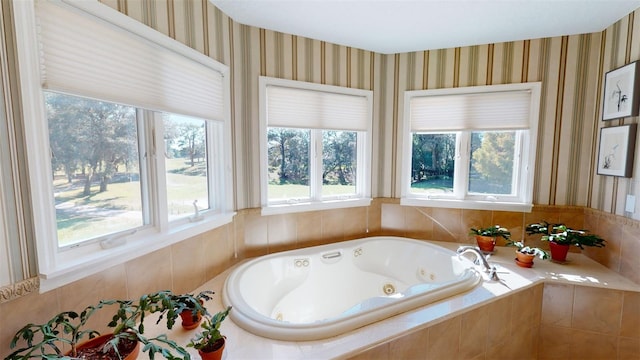 bathroom featuring tiled tub