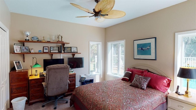 carpeted bedroom with ceiling fan