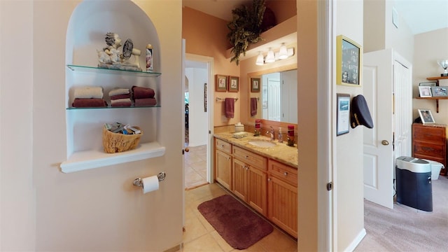 bathroom with tile patterned flooring and vanity