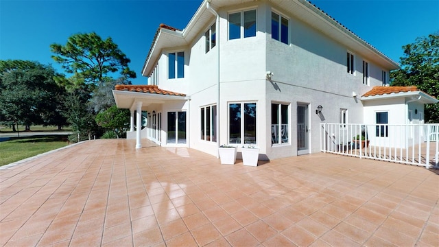 rear view of house with a patio