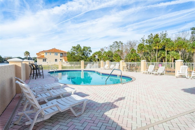 view of swimming pool with a patio area