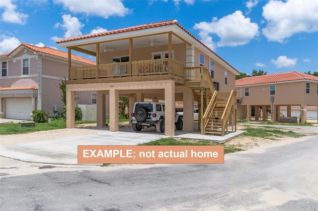 view of front of property featuring a carport and ceiling fan