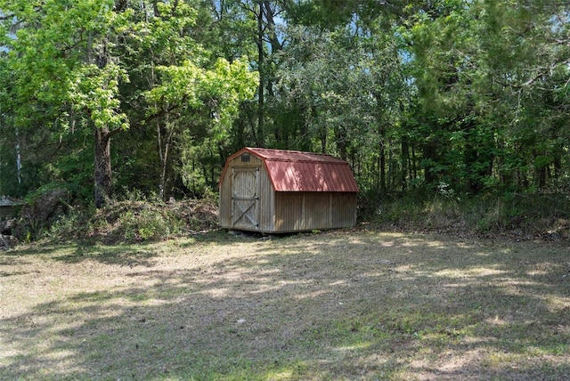 view of outbuilding with a lawn