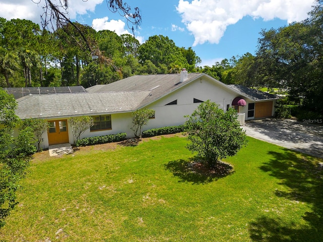 ranch-style home with a front yard