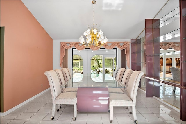 dining space with light tile floors, vaulted ceiling, a notable chandelier, and french doors