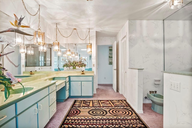 bathroom with a bidet and dual vanity