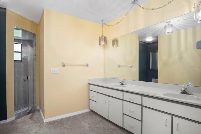 bathroom featuring an enclosed shower and dual bowl vanity