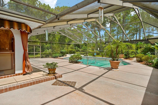 view of swimming pool featuring a patio area and glass enclosure