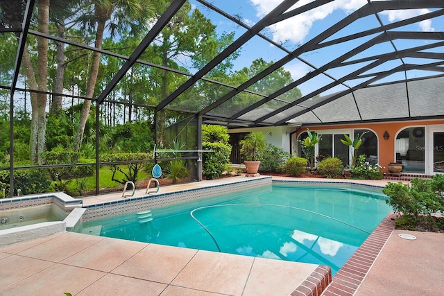 view of pool featuring glass enclosure and a patio