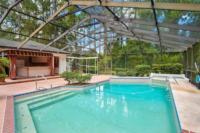 view of pool featuring a patio area and a lanai