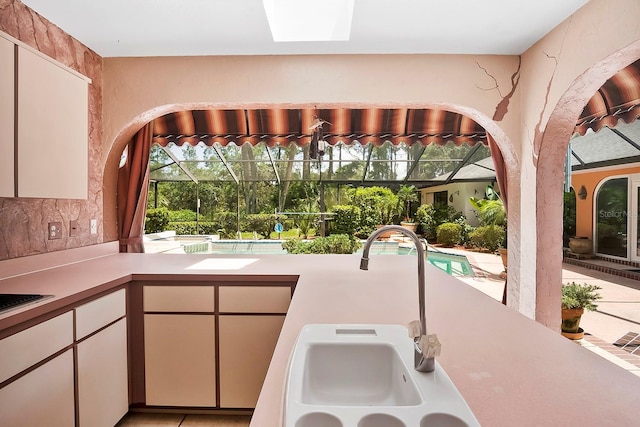 kitchen featuring backsplash and sink