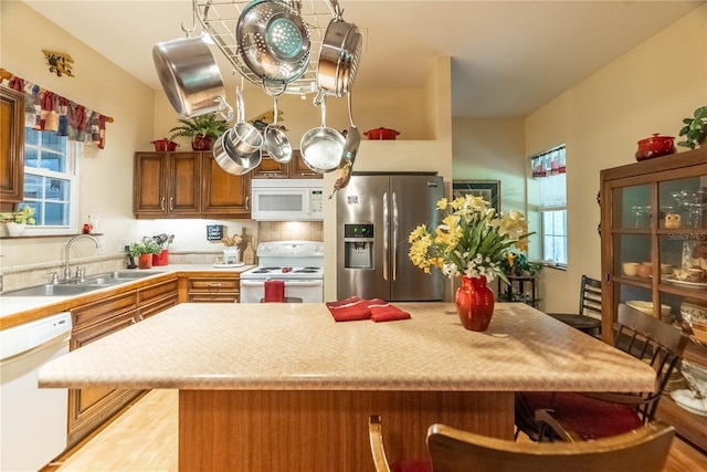 kitchen with white appliances and sink