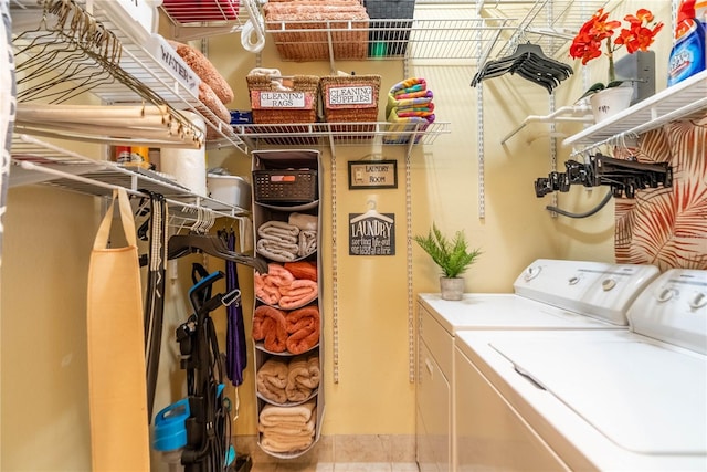 clothes washing area with washing machine and clothes dryer