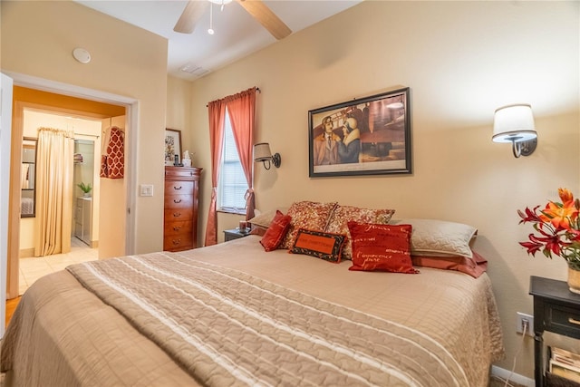 bedroom with ensuite bath and ceiling fan