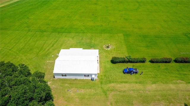 birds eye view of property with a rural view