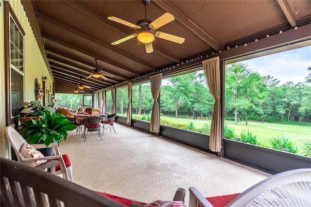 sunroom / solarium with vaulted ceiling and ceiling fan