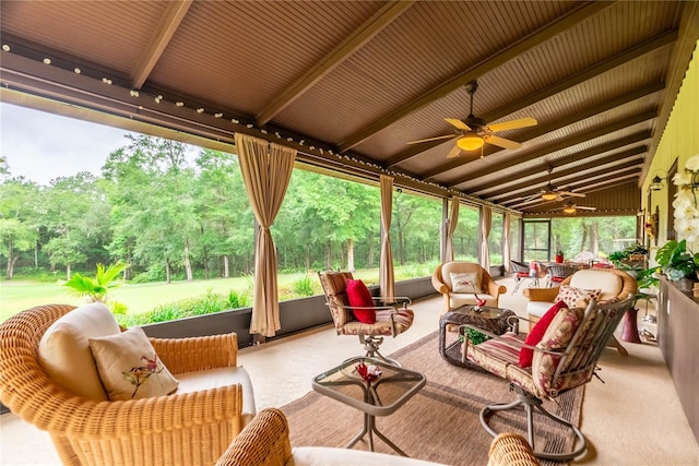 sunroom featuring lofted ceiling with beams