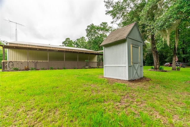 view of outdoor structure featuring a lawn