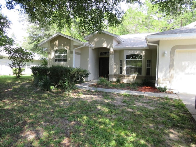 single story home featuring a garage