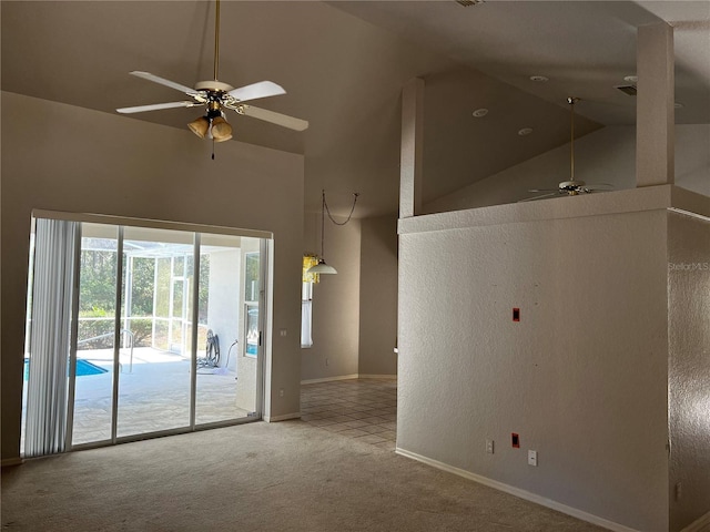 interior space with ceiling fan and high vaulted ceiling