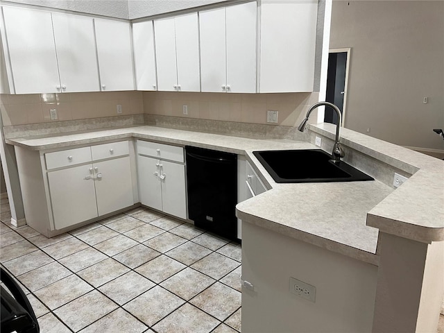 kitchen with dishwasher, sink, white cabinets, and kitchen peninsula