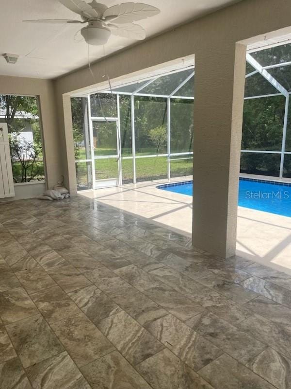 view of pool featuring ceiling fan