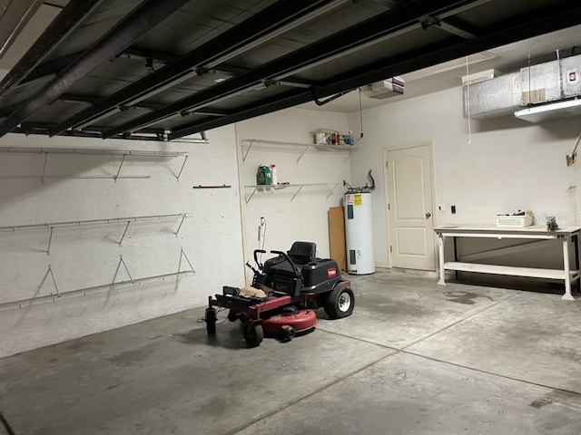 garage with a garage door opener and electric water heater